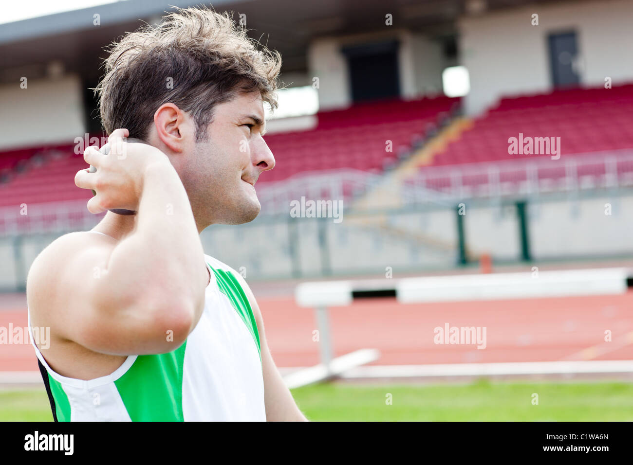 Determined male athlete preparing to throw weight Stock Photo Alamy