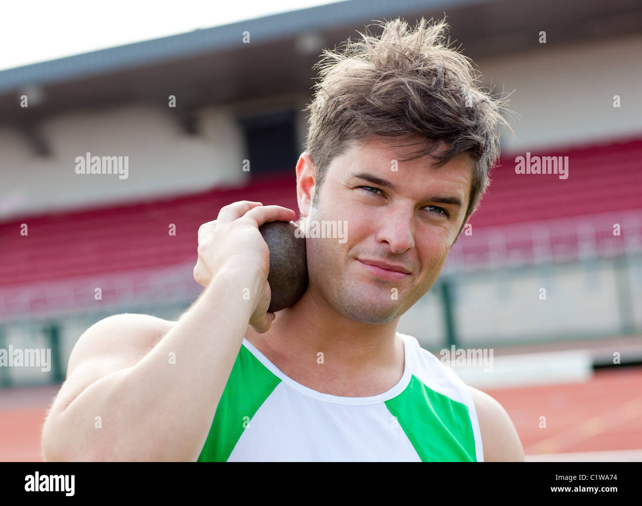 Concentrated male athlete preparing to throw weight Stock Photo Alamy