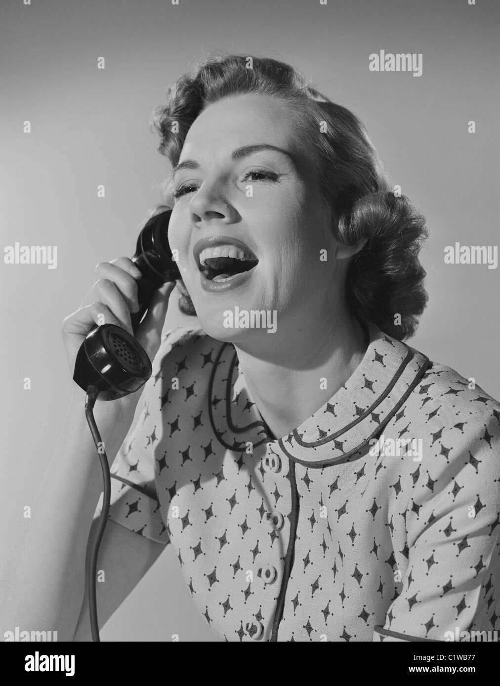 Black woman on phone laughing Black and White Stock Photos & Images - Alamy