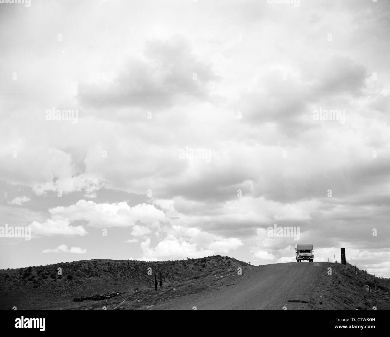 Truck driving down country road Stock Photo Alamy