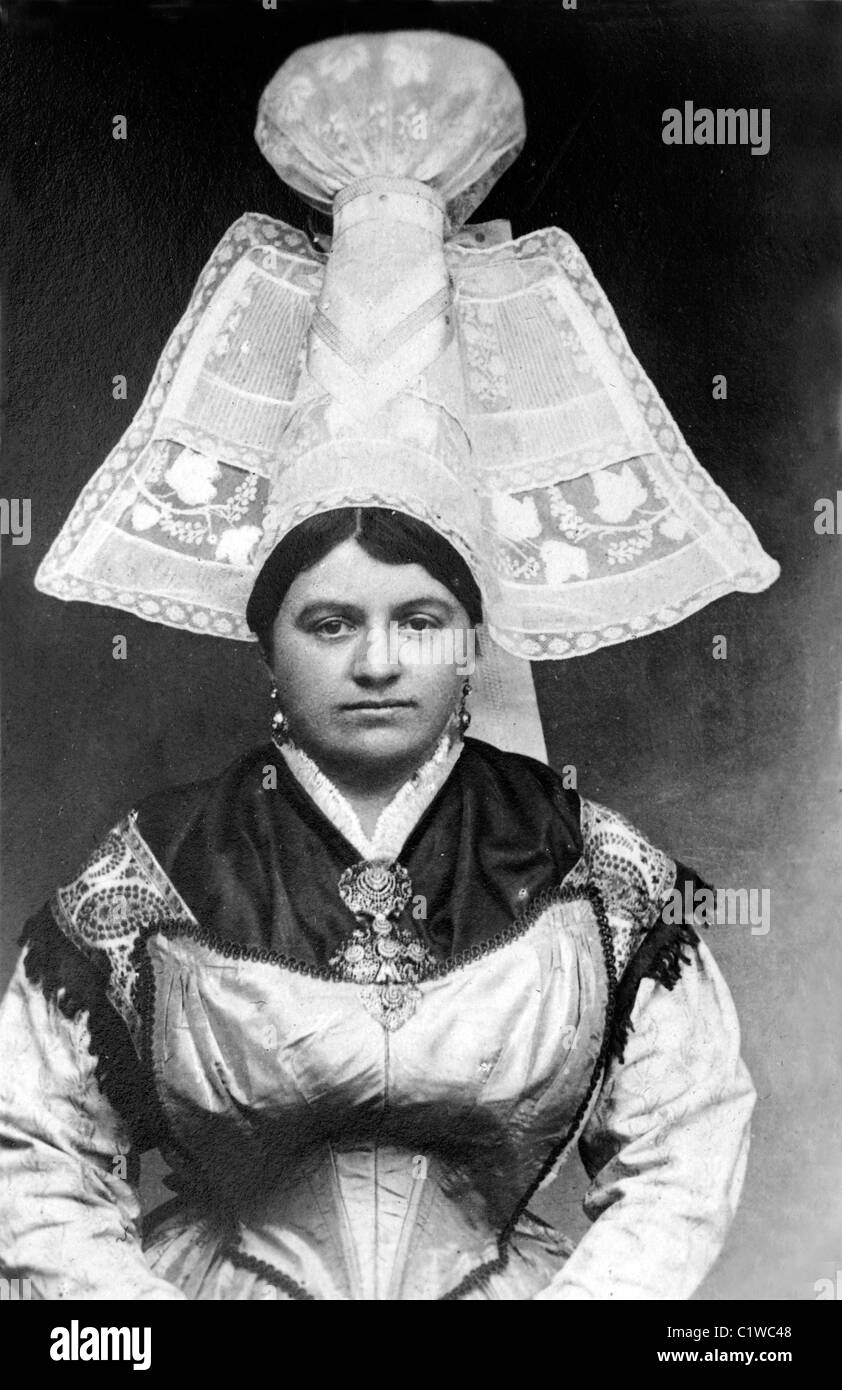 Portrait of Norman Woman Wearing a Traditional Lace Headdress and Regional Costume or Folkloric Dress from Avranches, Normandy (c1900) France Stock Photo