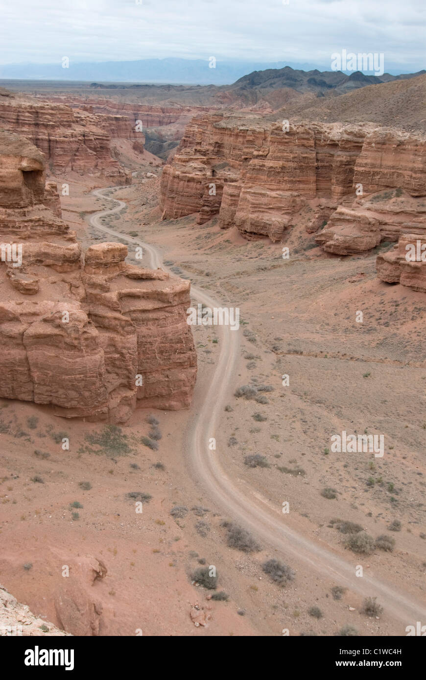 Kazakhstan, Charyn Canyon, Dirt road through stone landscape Stock Photo