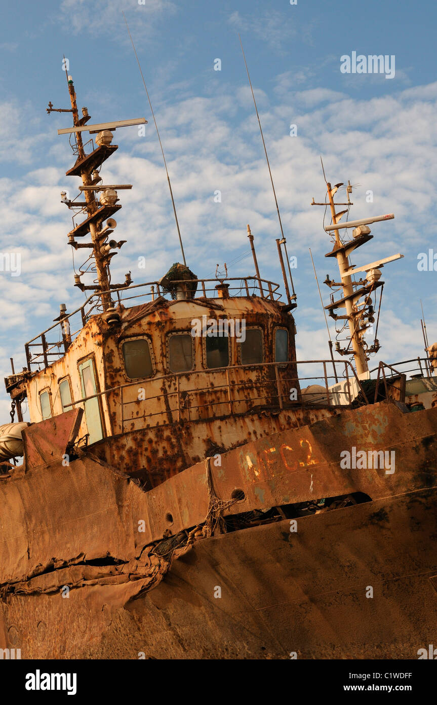 Mauritania, Nouadhibou, Ship wrecks rusting on shores of beach of Nouadhibou, one of the largest ship wreck cemeteries worldwide Stock Photo