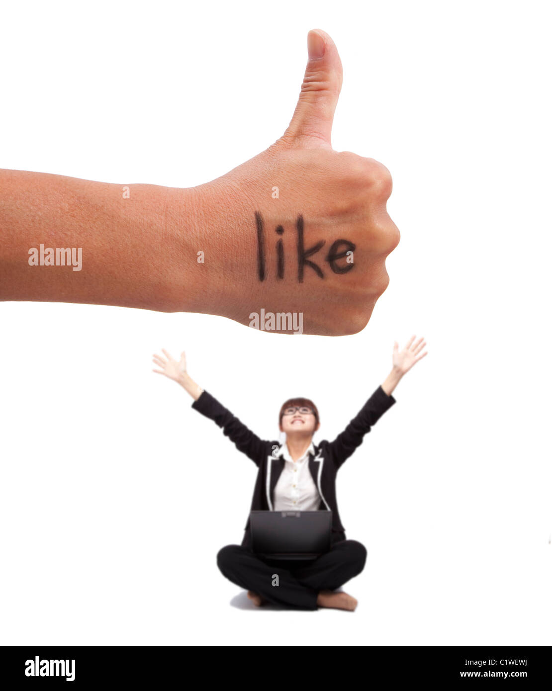 Thumb up with like mark. young woman enjoy social network on the internet Stock Photo