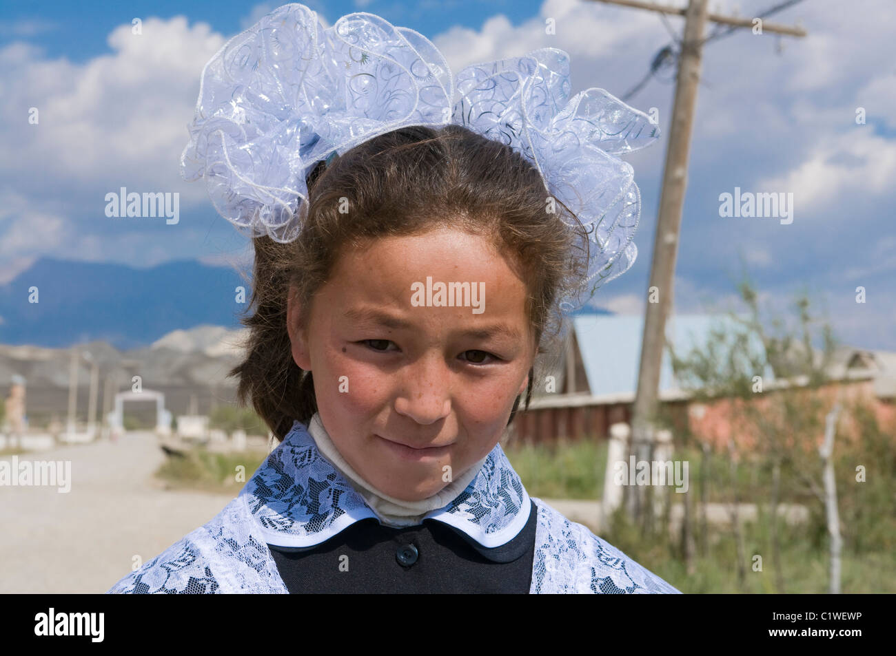 Kyrgyzstan, Tien Shan Mountains, Torugart Pass, Portrait of girl in traditional outfit Stock Photo