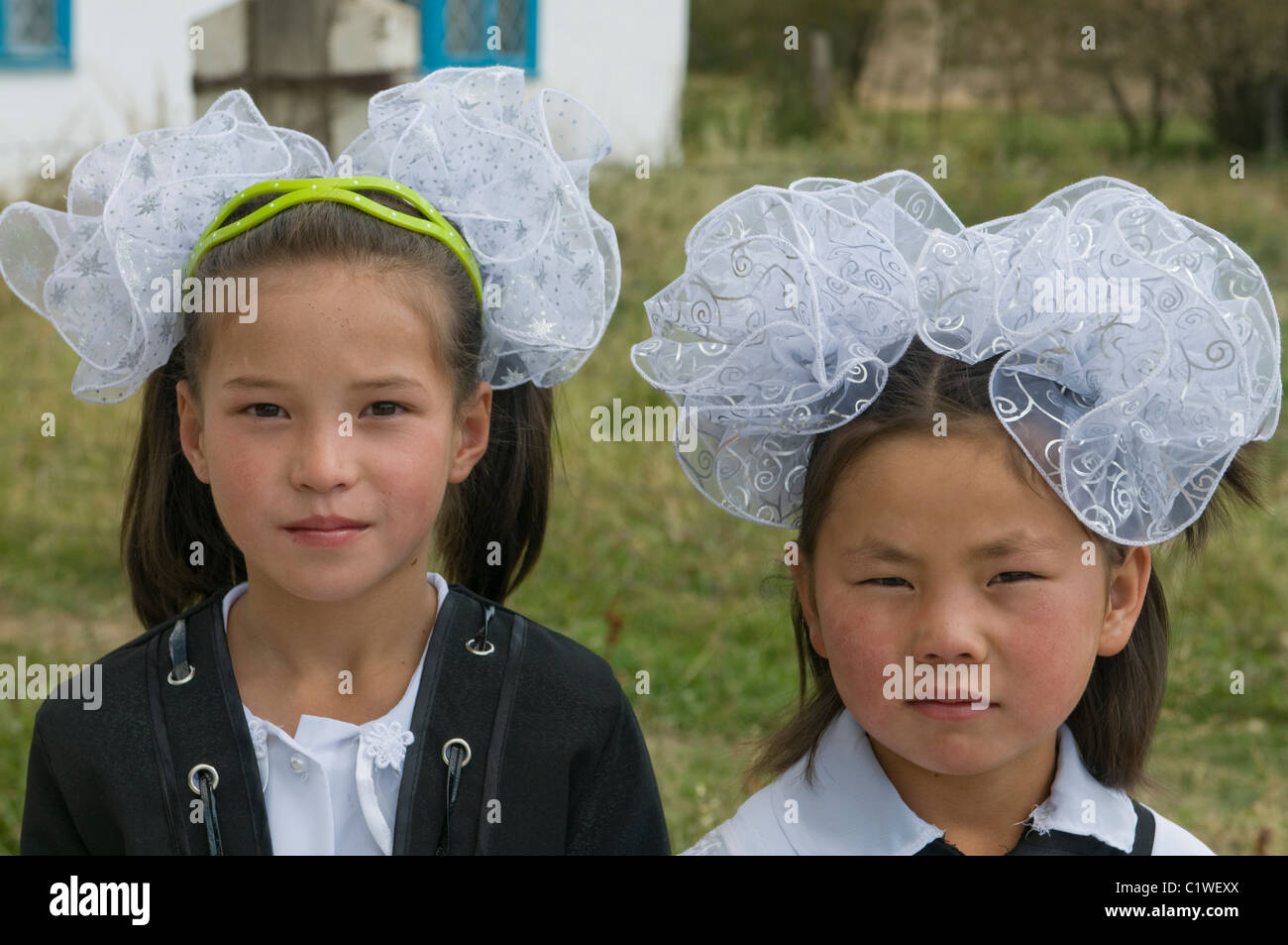 Kyrgyzstan, Tien Shan Mountains, Torugart Pass, Girls in traditional clothes Stock Photo