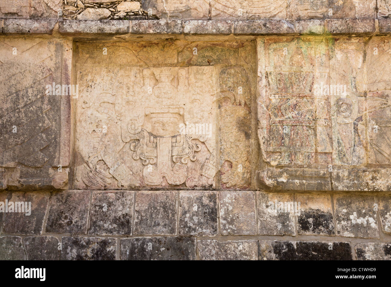 Stone relief of Quetzalcoatl-Kukulkan as the 'Morning Star' on the side panel of the Venus Platform in Chichen Itza, Mexco. Stock Photo