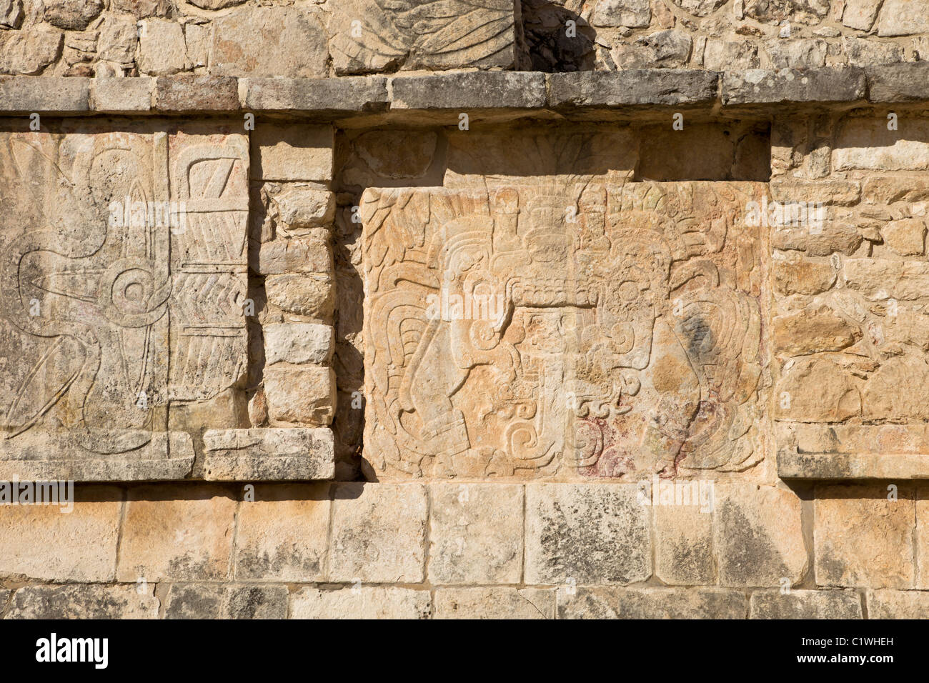 Stone relief of Quetzalcoatl-Kukulkan as the 'Morning Star' on the side panel of the Venus Platform in Chichen Itza, Mexco. Stock Photo