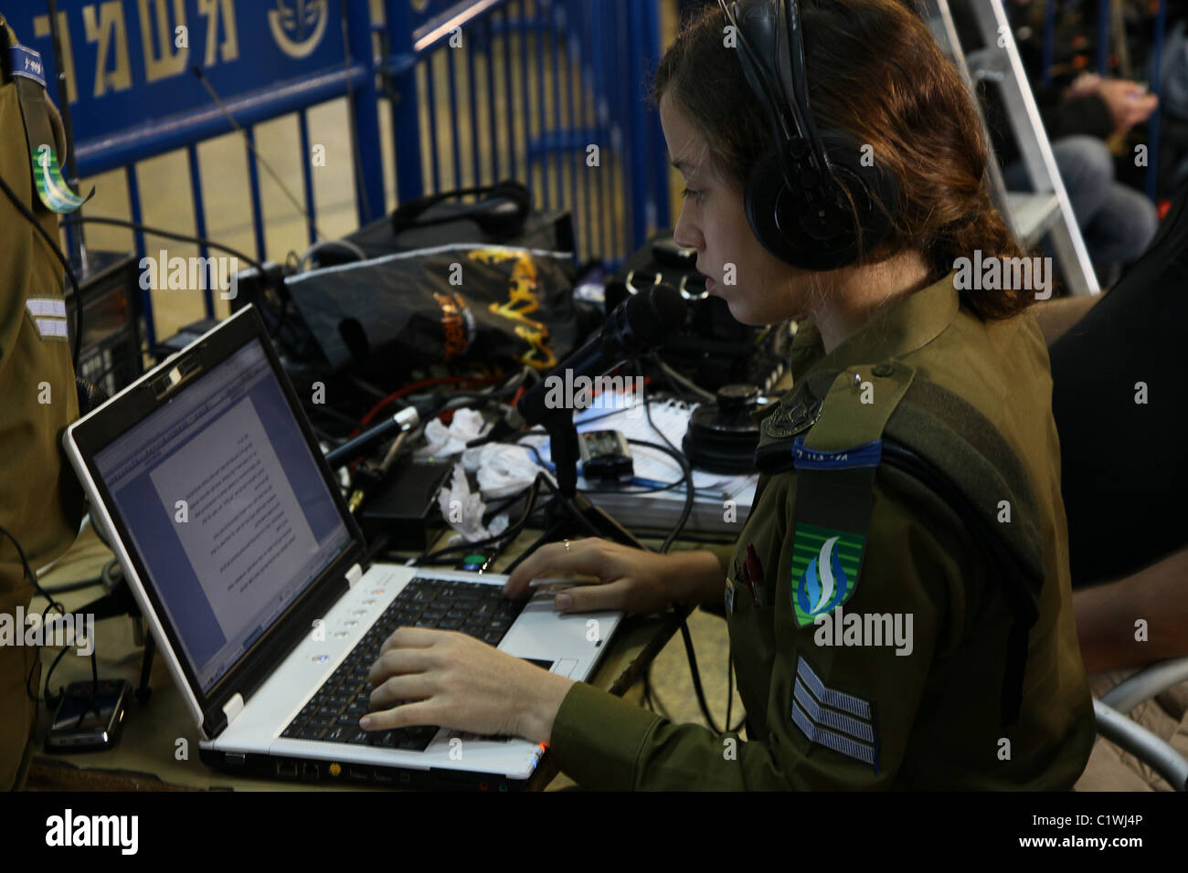 Amalya Duek from radio station Army Radio or Galei Tzahal, known in Israel  by its acronym Galatz, operated by the Israel Defense Forces working on a  computer during a news coverage in