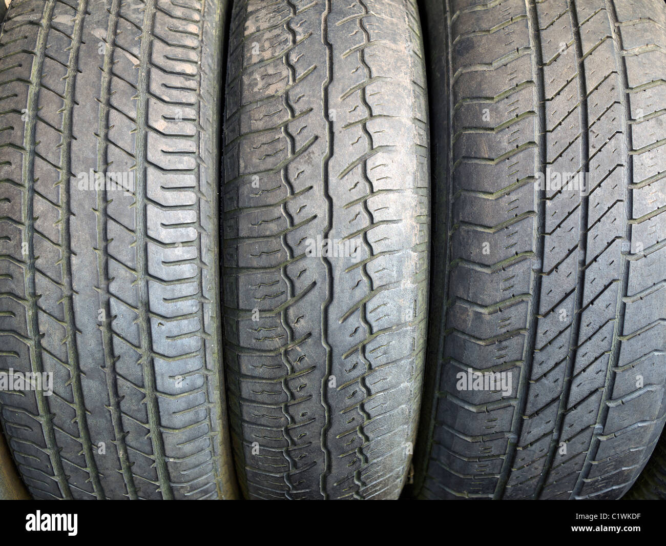 Worn car tyres in a row at the Eden project St Austell Cornwall UK