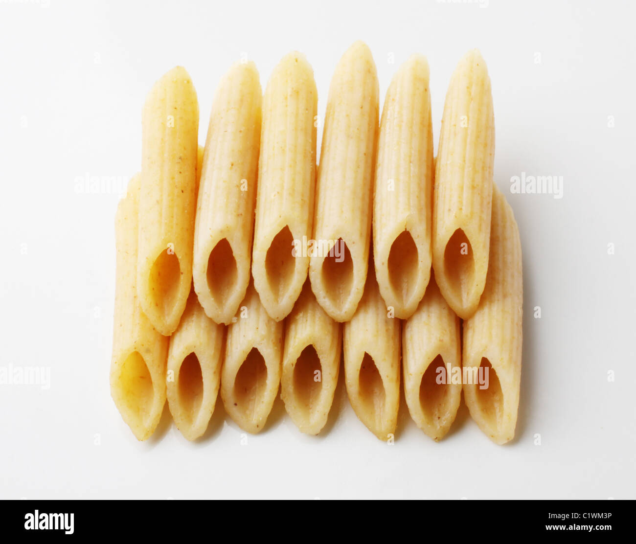 Whole wheat pasta tubes - studio shot Stock Photo
