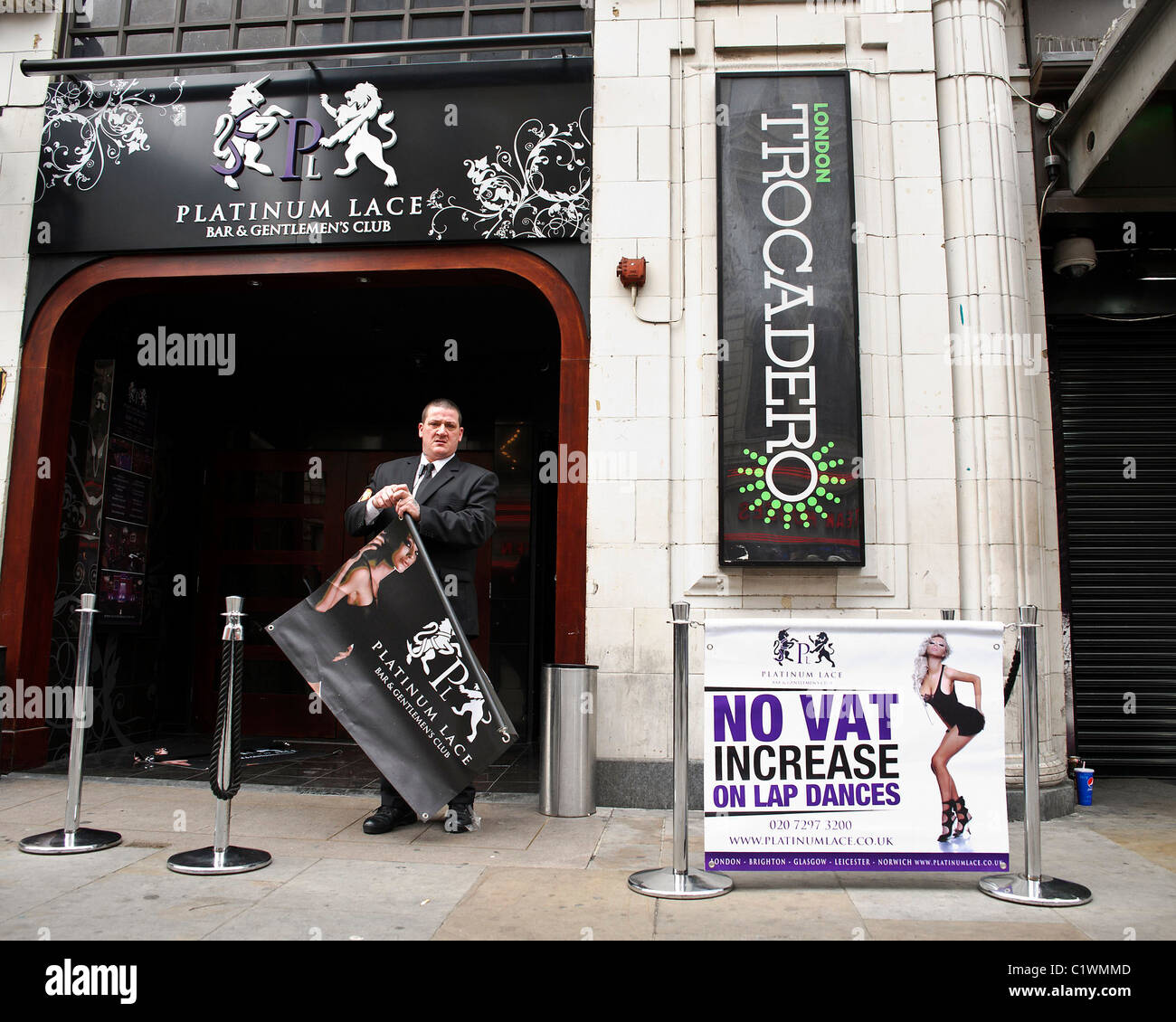 26/03/2011. A man puts sign out advertising a Lap Dancing club in Coventry Street, London. Stock Photo