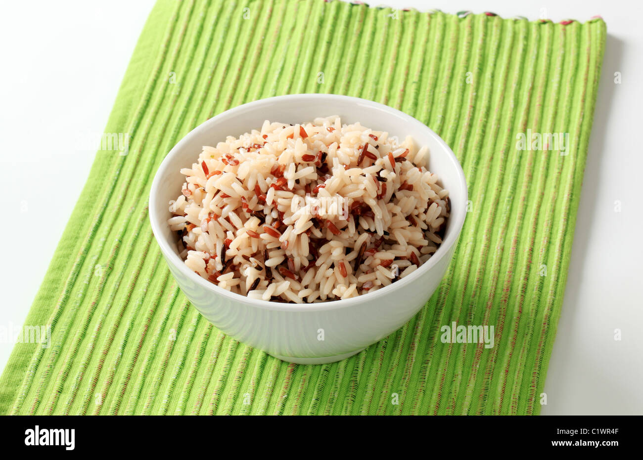 Bowl of cooked mixed rice - studio Stock Photo - Alamy
