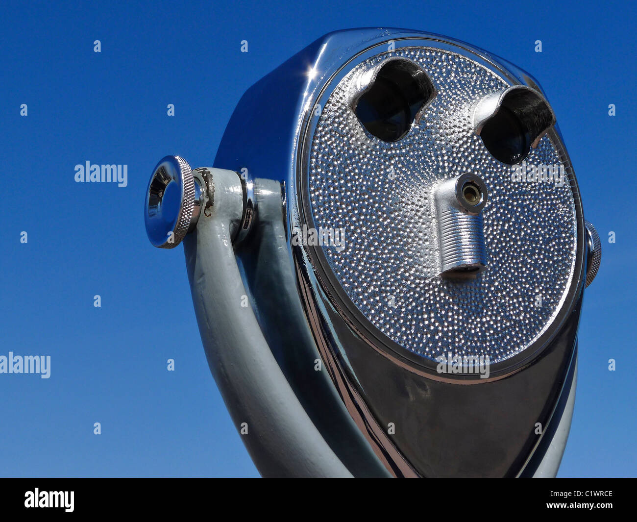 Sightseeing tourist viewer against blue sky. Stock Photo