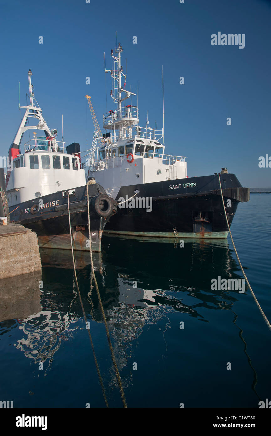 Tugboats Saint Denis  and VB Iroise moored in Brest commercial harbor. Stock Photo