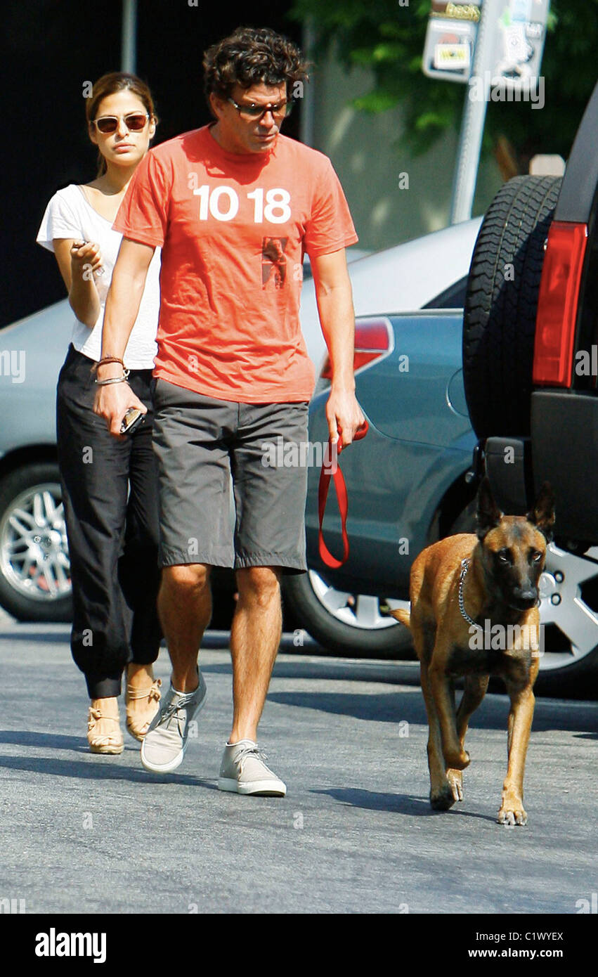 Actress Eva Mendes and her boyfriend George Gargurevich have lunch in West Hollywood with their pet dog. Los Angeles, Stock Photo