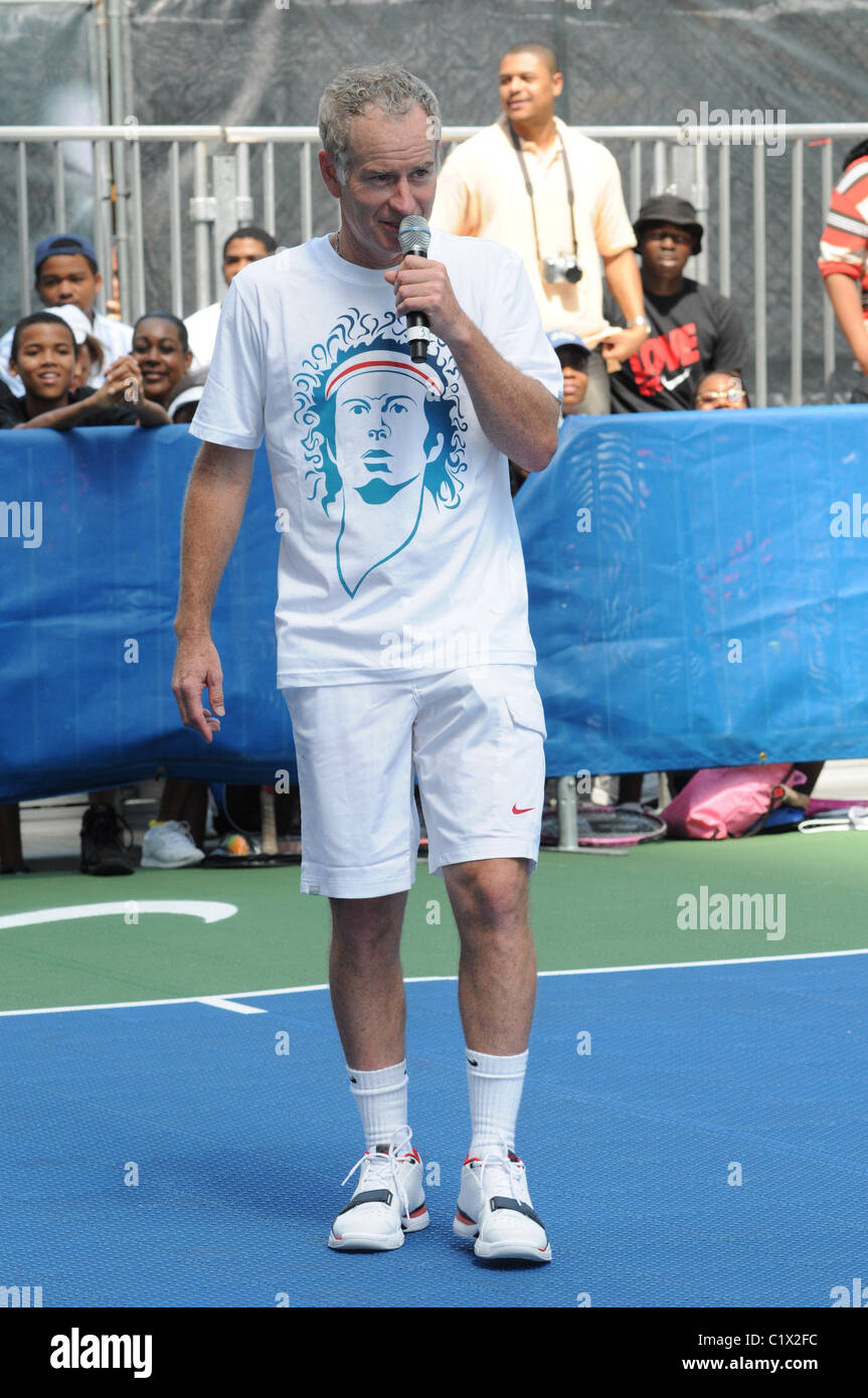 John McEnroe wearing a t-shirt with his face from 25 years ago on it The  Nike Game, Set, NYC tennis event ahead of the US Open Stock Photo - Alamy