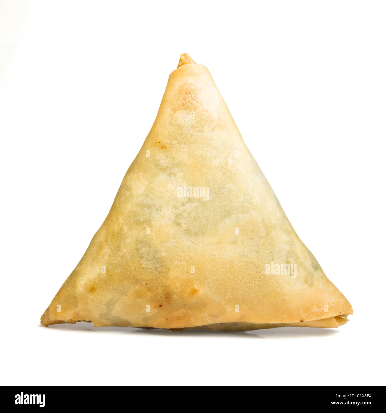 Cooked golden Samosa's from low perspective isolated on white. Stock Photo
