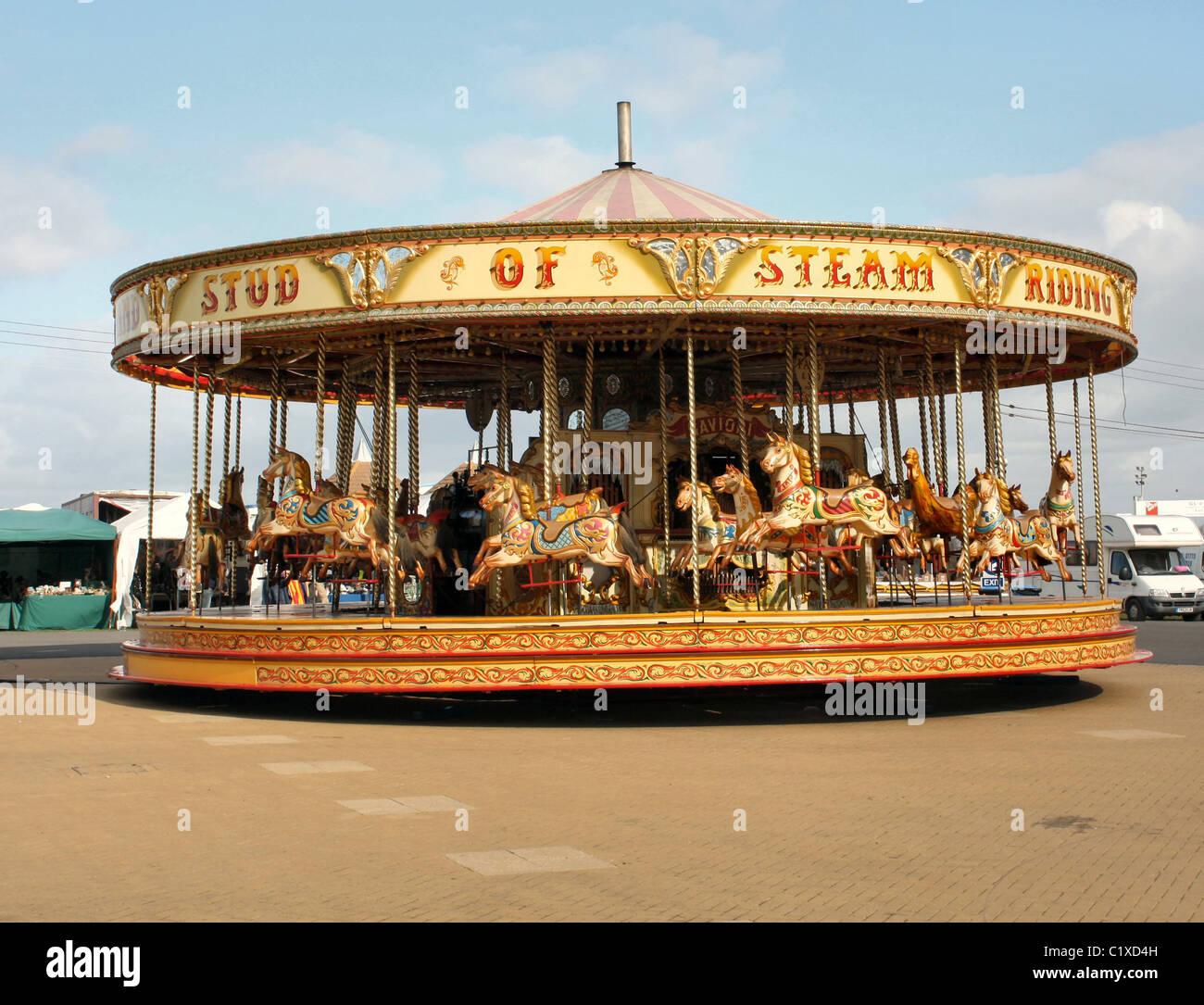 Merry-go-round on bright sunny day. East of England Show Stock Photo