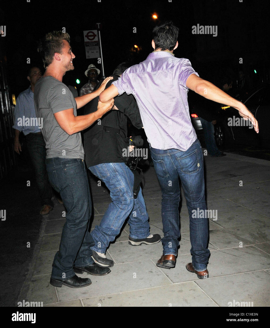 Lance Bass' date protects him from photographers by nearly getting into a fight while leaving Boujis. The former NSYNC singer Stock Photo