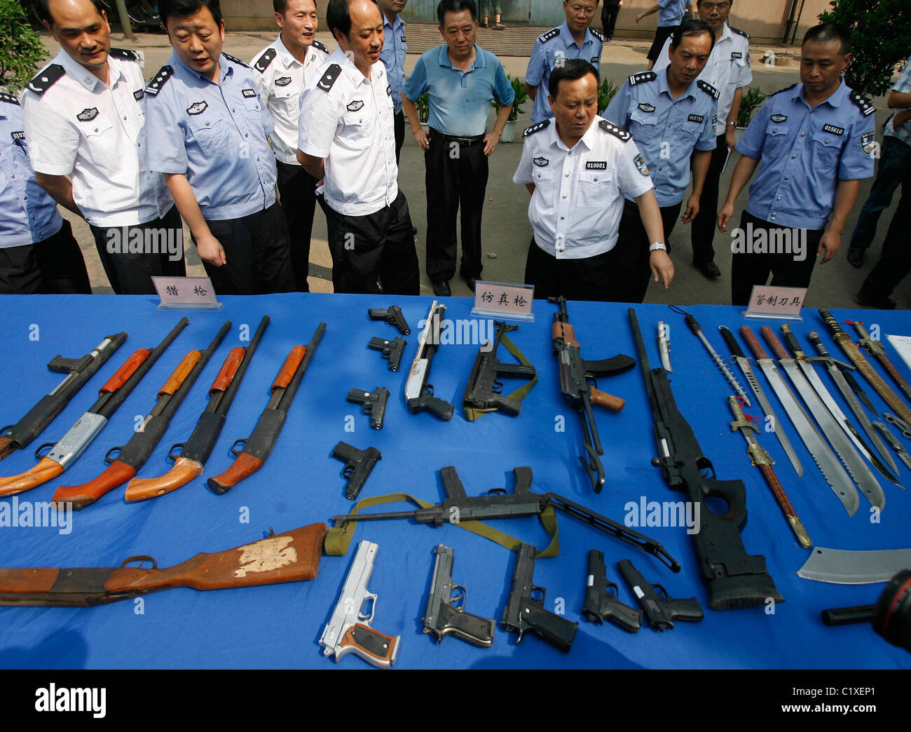 Police in China destroy more than six hundred seized illegal guns at an