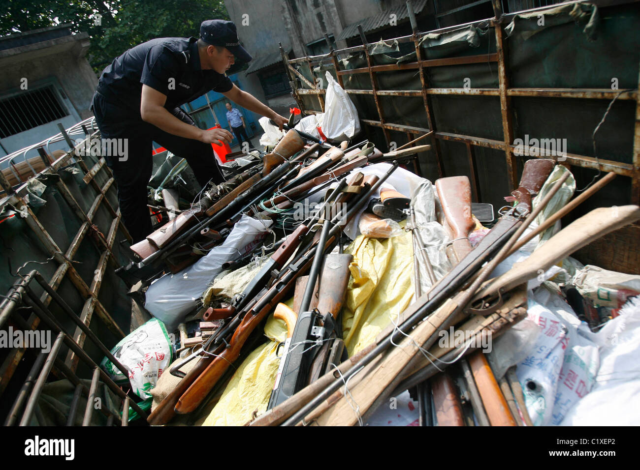 Police in China destroy more than six hundred seized illegal guns at an