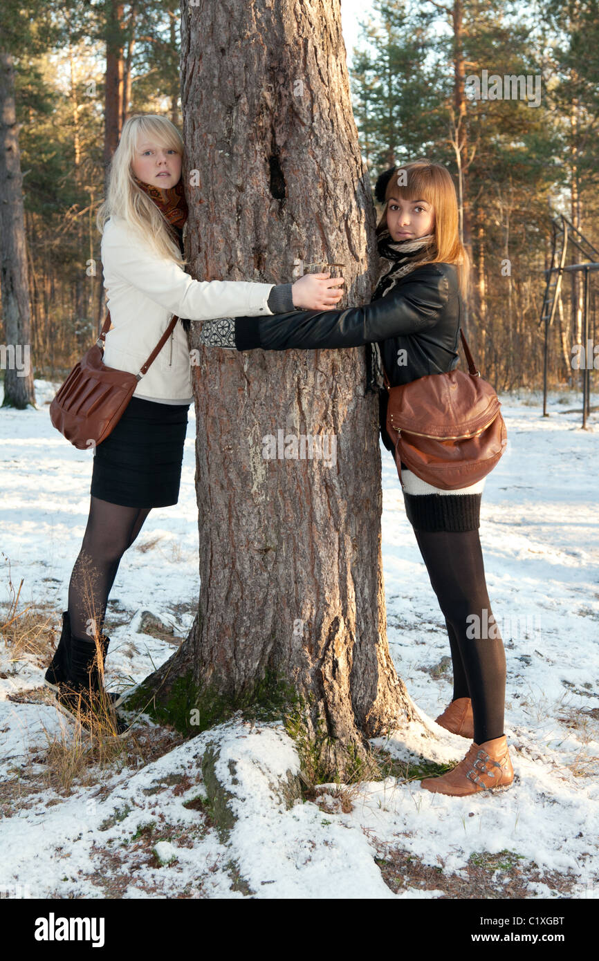 Portrait two young beautiful girls in wood Stock Photo - Alamy