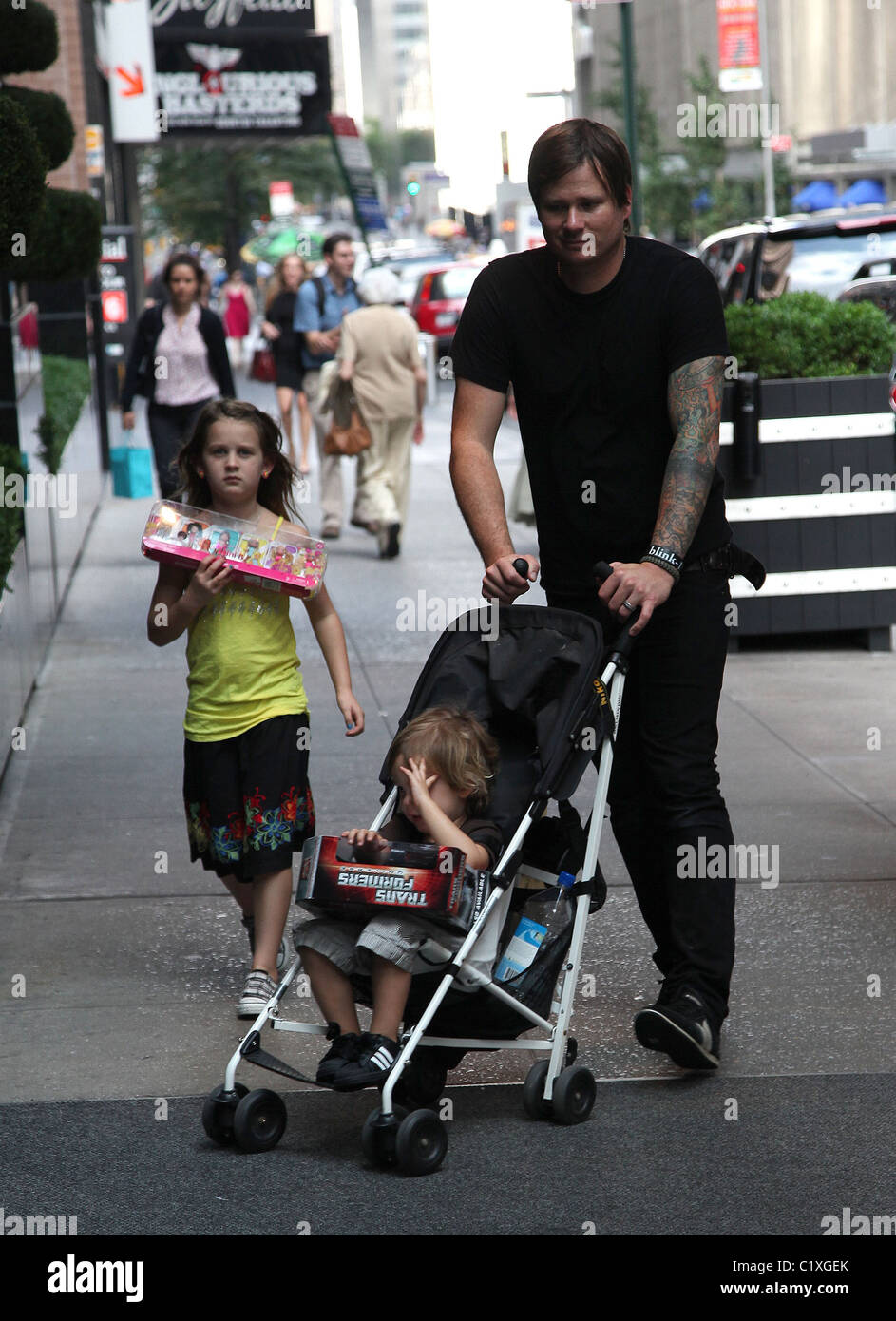 Tom DeLonge walks through Soho with his daughter Ava Elizabeth New