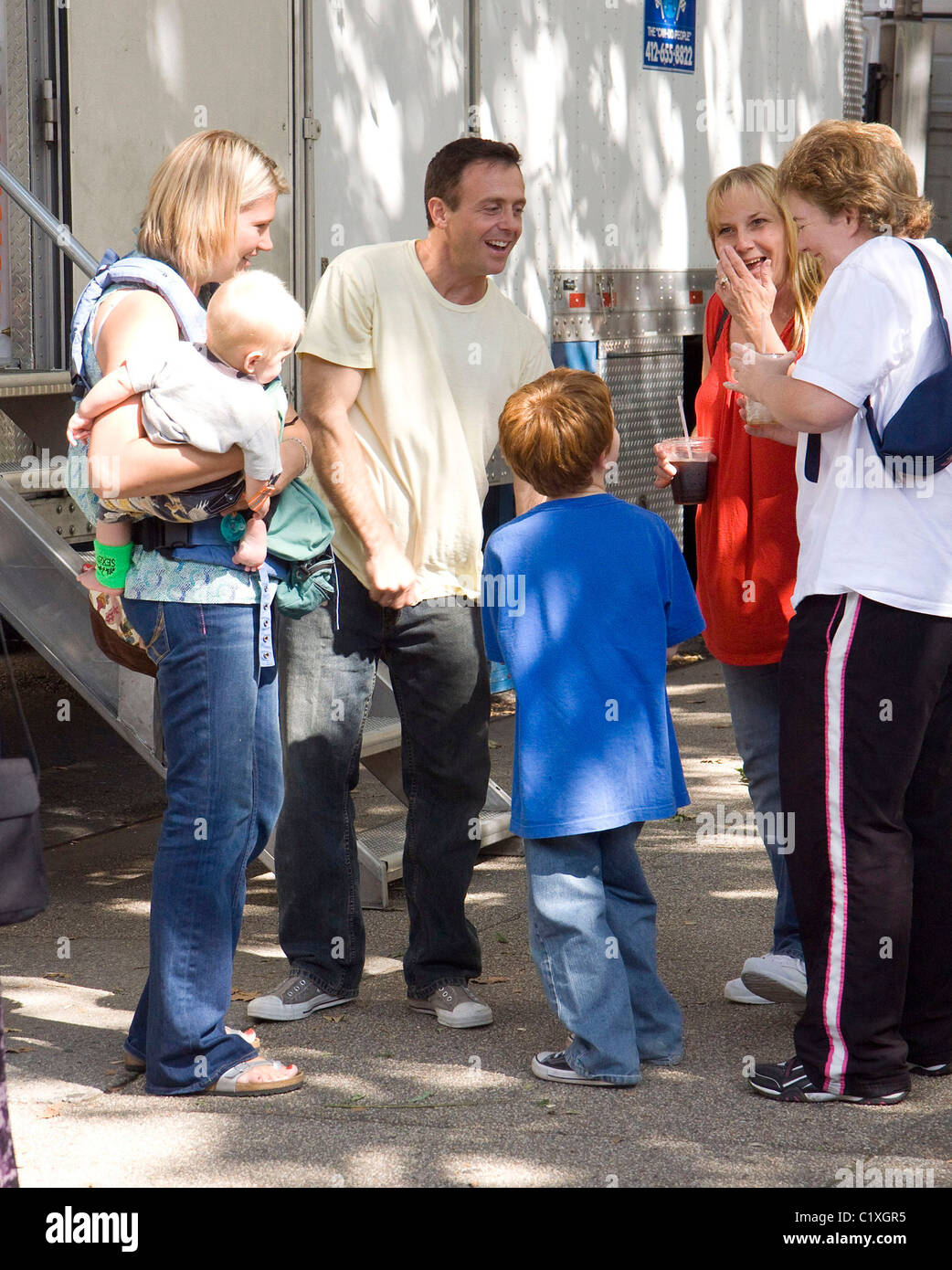 David Eigenberg, son Louie Steven Eigenberg, wife Chrysti and movie son Joseph Pupo on the set of new movie Sex and the City Stock Photo pic