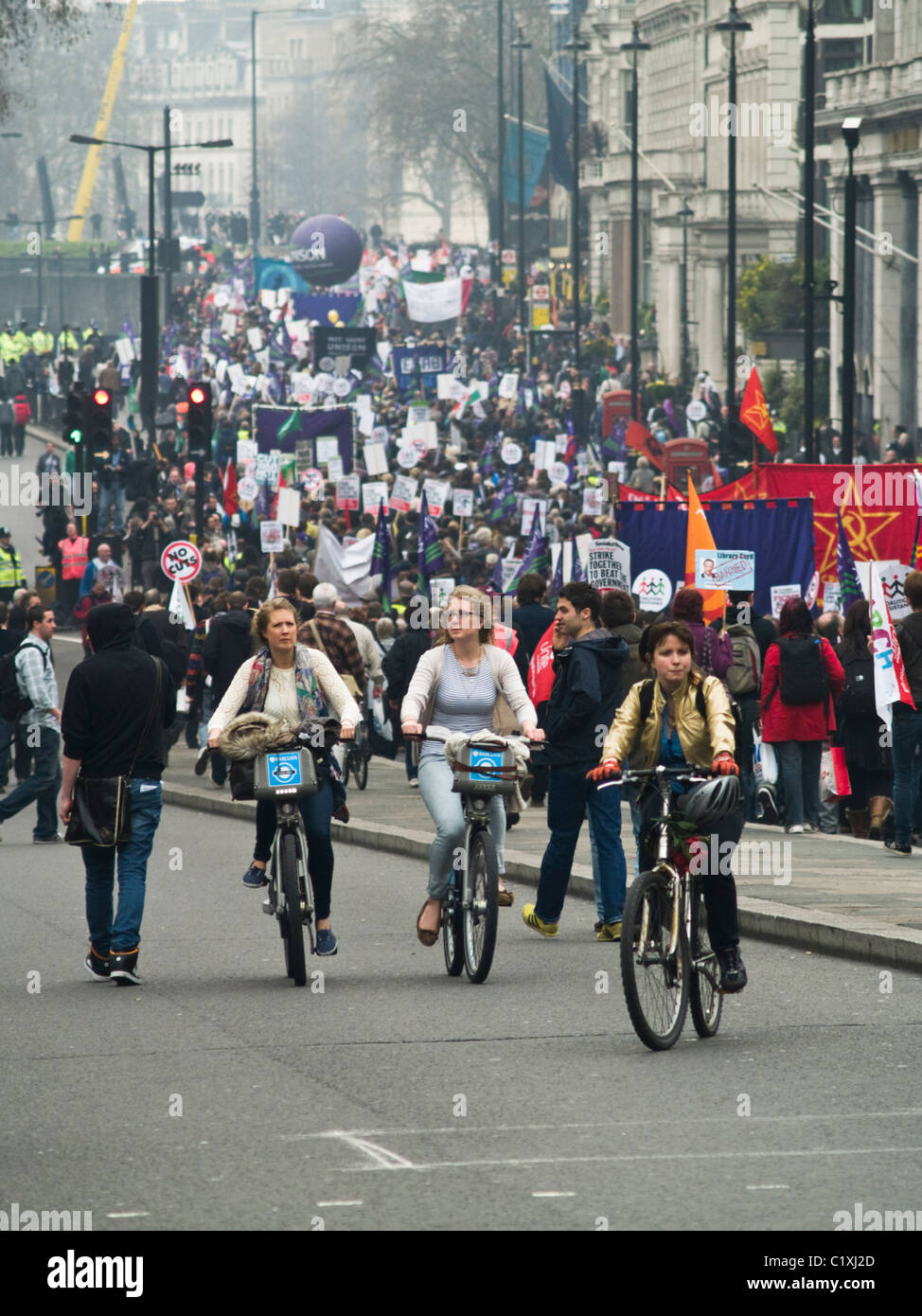 Londoners carry on with their daily lives during the anti government protests of 26 March 2011 Stock Photo
