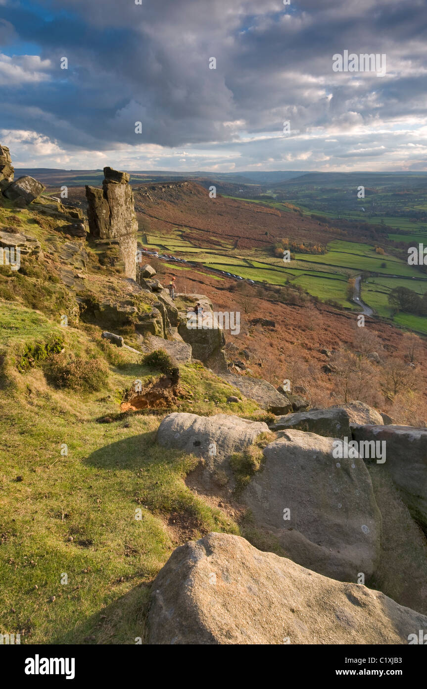 Gritstone rock formations at Curbar Edge, Peak District, Derbyshire, with rock climbers, November 2010. Stock Photo
