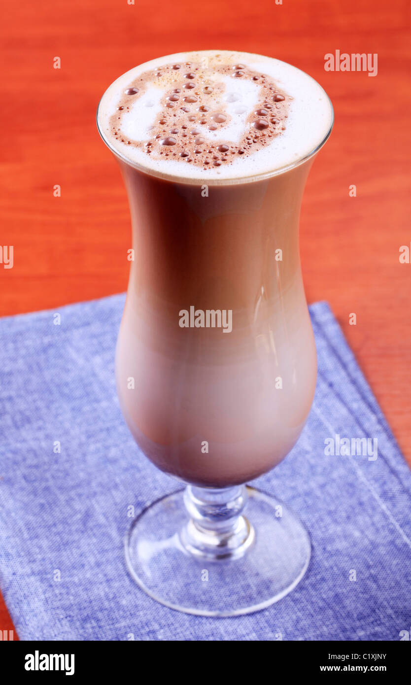 Chocolate drink with milk froth in tall glass Stock Photo Alamy