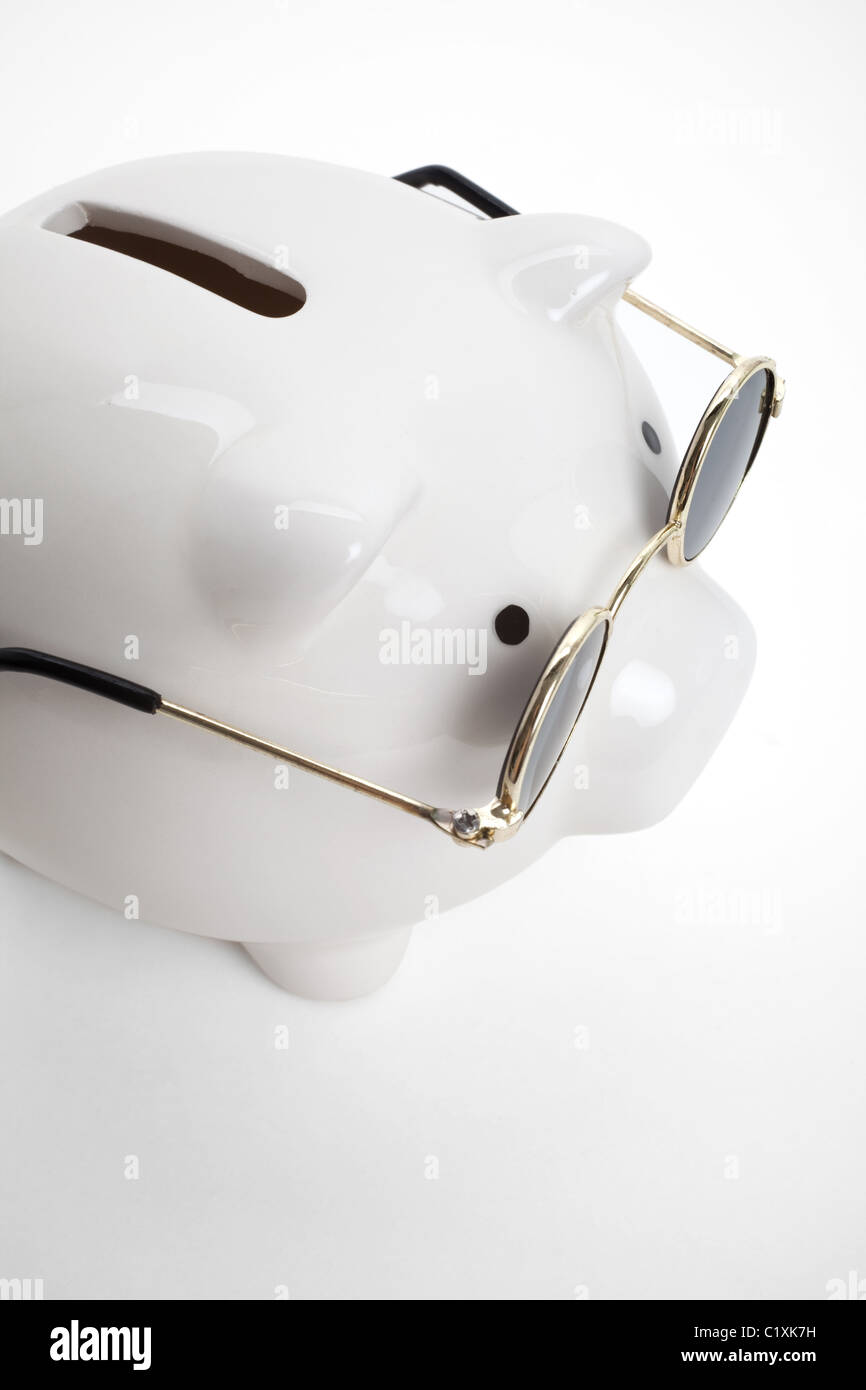Piggy Bank and Sunglasses , concept of savings Stock Photo