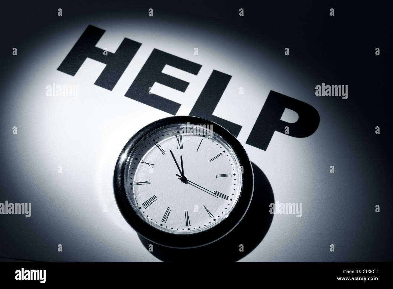 Clock and word, concept of Need Help Stock Photo