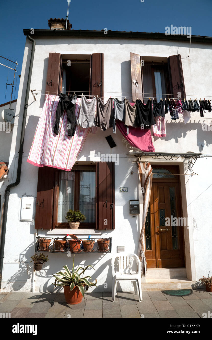 Clothes washing line, colourful houses, Burano, Venice, Italy Stock Photo