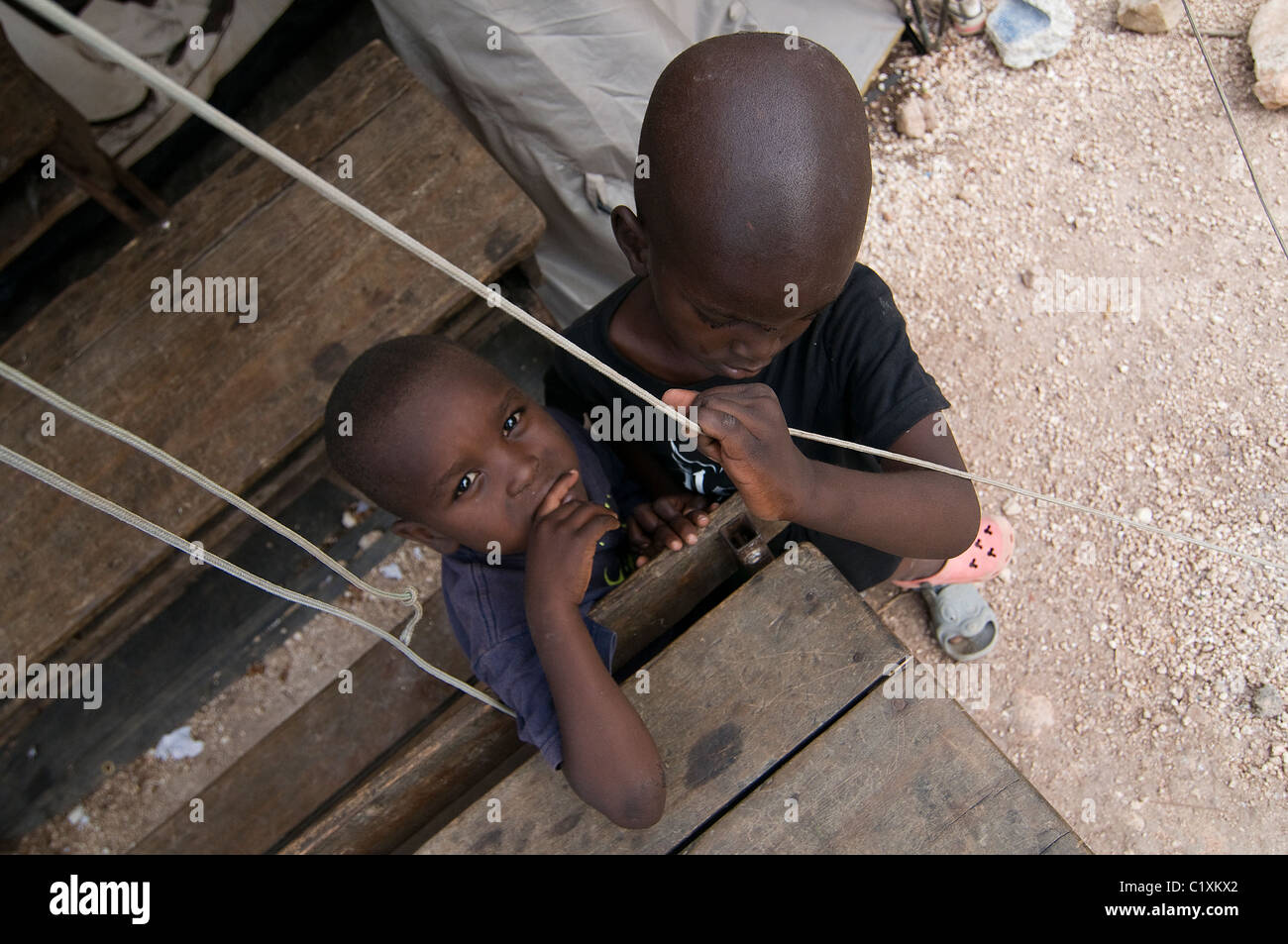 Orphans at a temporary makeshift dwelling compound in the suburbs of Port-au-Prince Haiti Stock Photo
