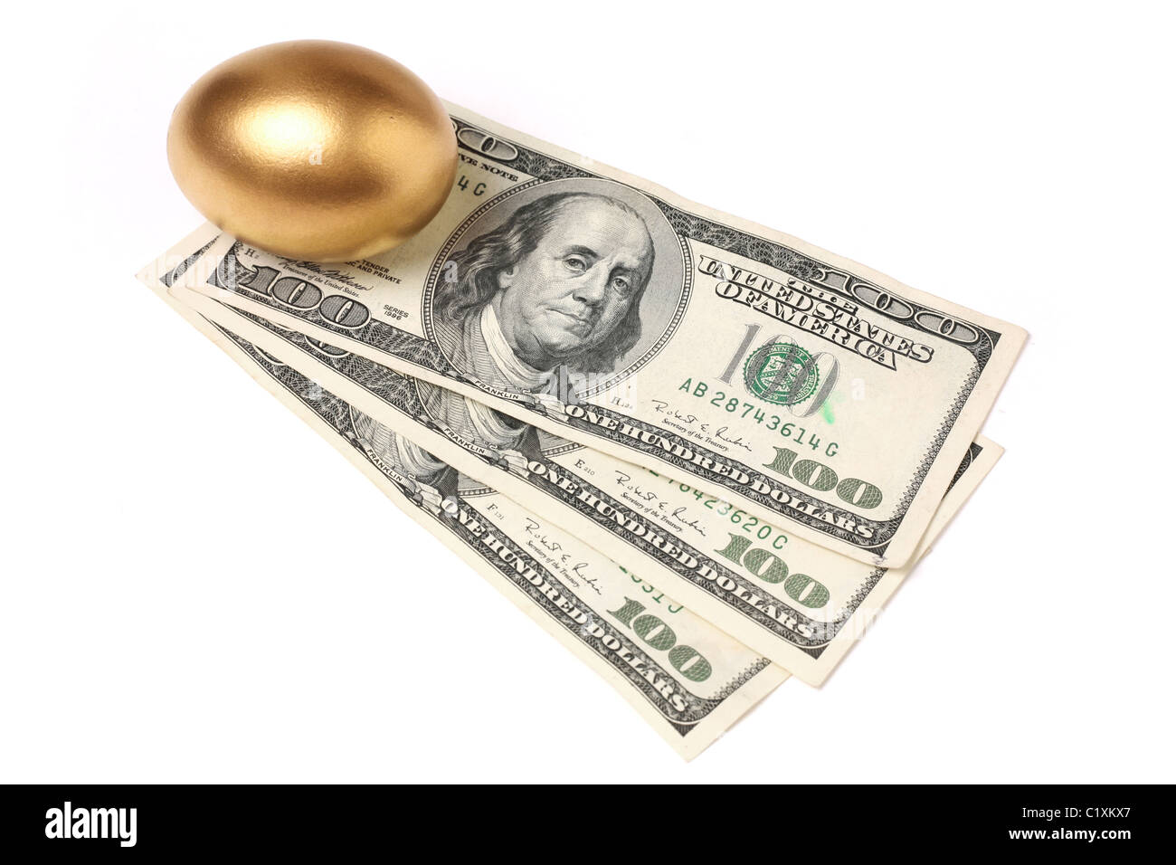 Golden eggs. A symbol of making money and successful investment on green  background Stock Photo - Alamy