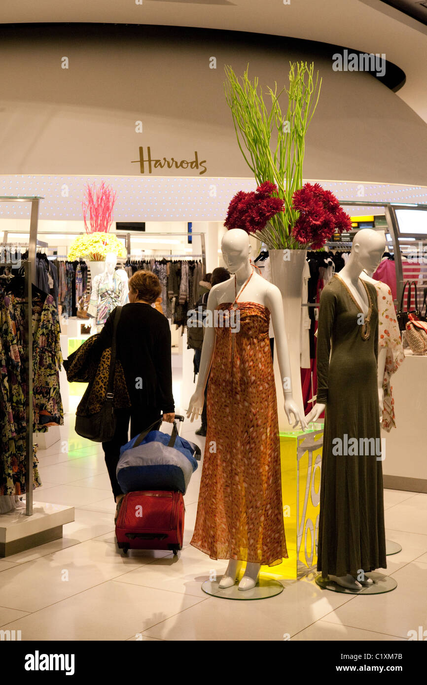 A passenger shopping at The Harrods store, terminal 5, Heathrow airport