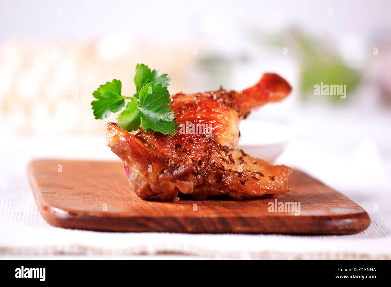 Roast leg of duck sprinkled with caraway seeds Stock Photo Alamy
