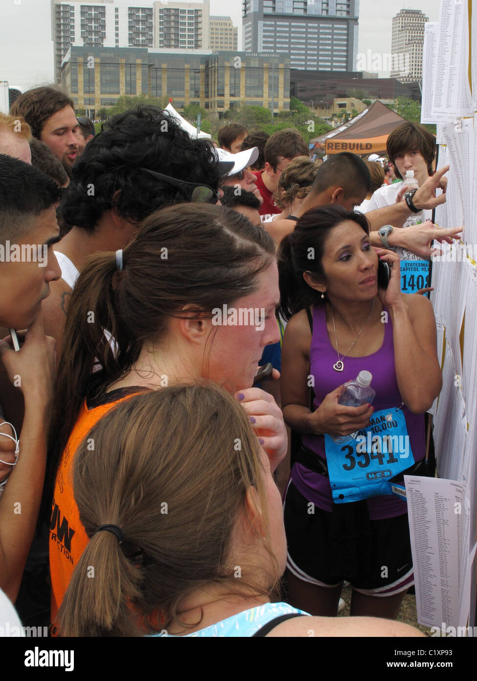 Capitol of Texas 10k - Cap 10k - runners looking at the results - over 20,000 runners participated. Stock Photo