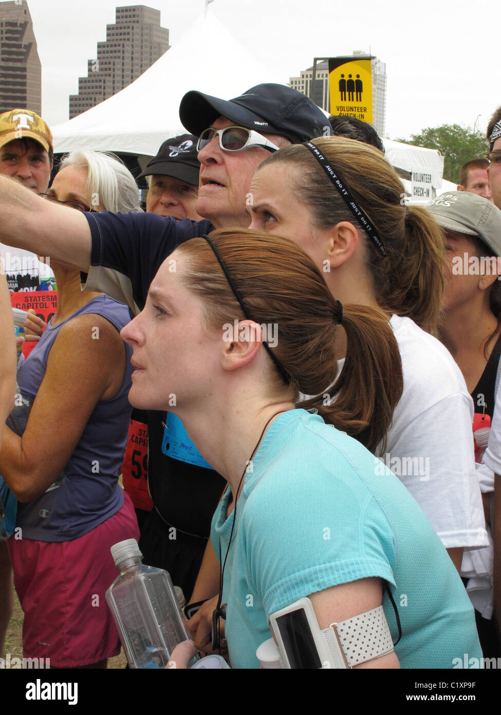 Runners at Capitol of Texas 10K looking at results in Austin, Texas - over 20,000 runners participated. Stock Photo