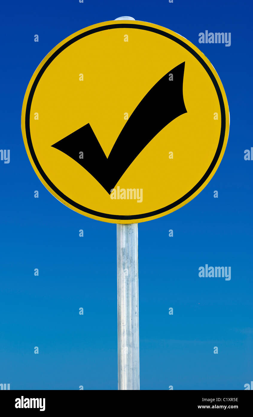 A road sign with a tick isolated on a blue graduated sky Stock Photo ...