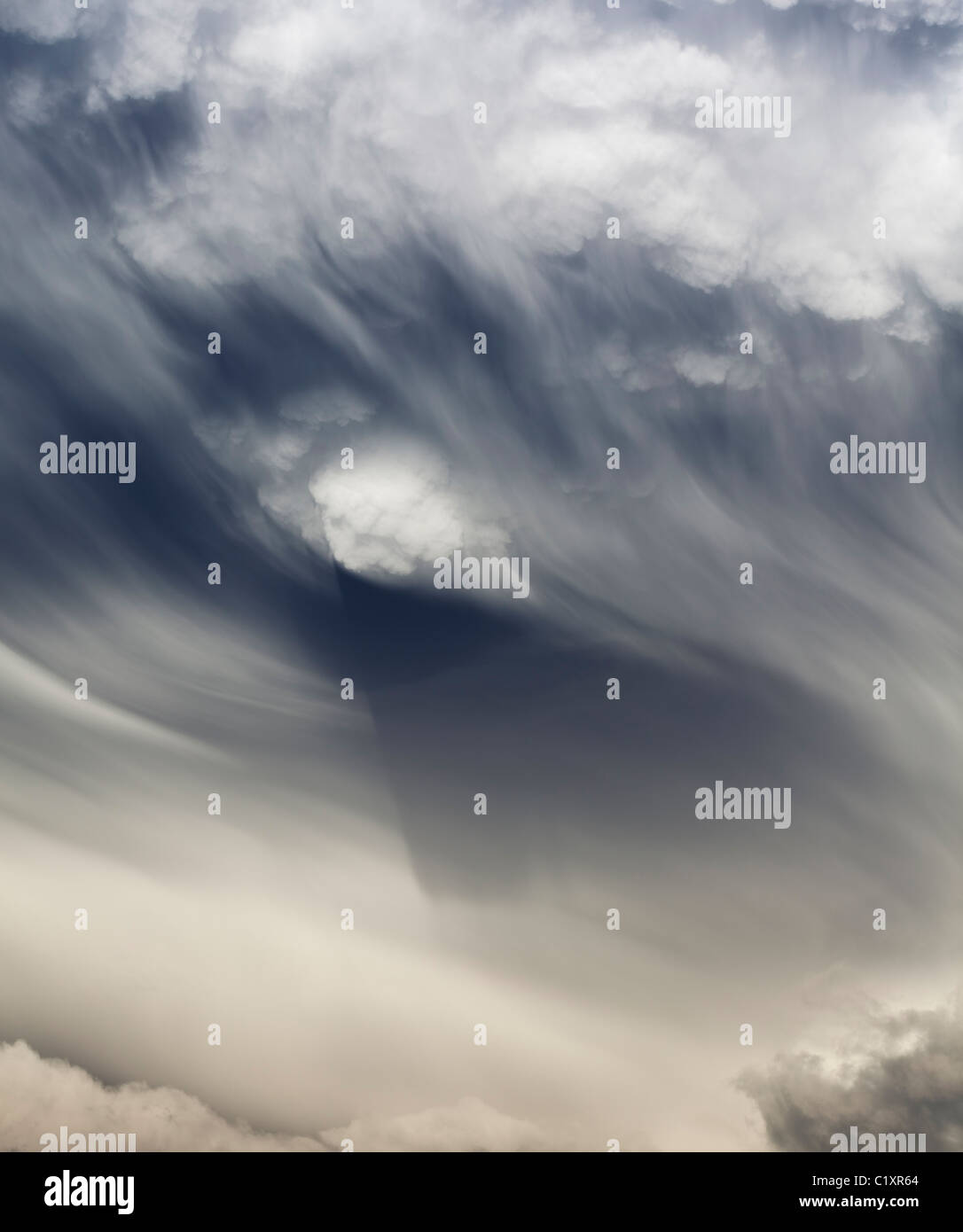 High-resolution panoramic image of a massive summer cumulonimbus cloud in dramatic late afternoon light over the Wasatch, Utah. Stock Photo