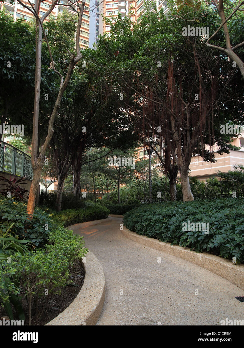 Walking road path in a formal garden Stock Photo