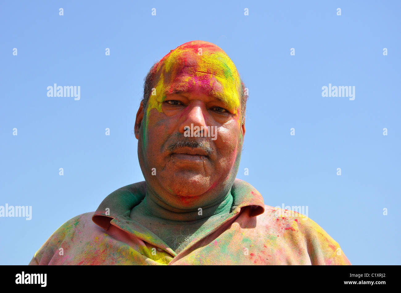 One Indian with colors on his face- Holi celebration Stock Photo