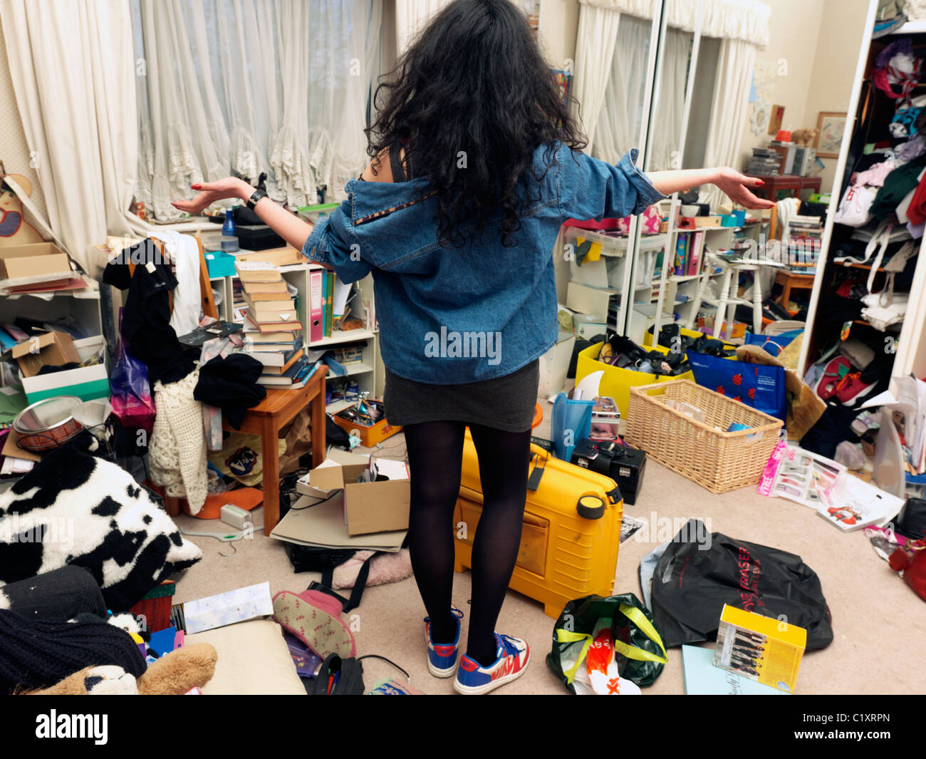 Teenage Girl In Untidy Bedroom Stock Photo - Alamy