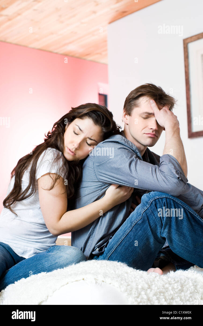 Woman hugging sad man Stock Photo Alamy