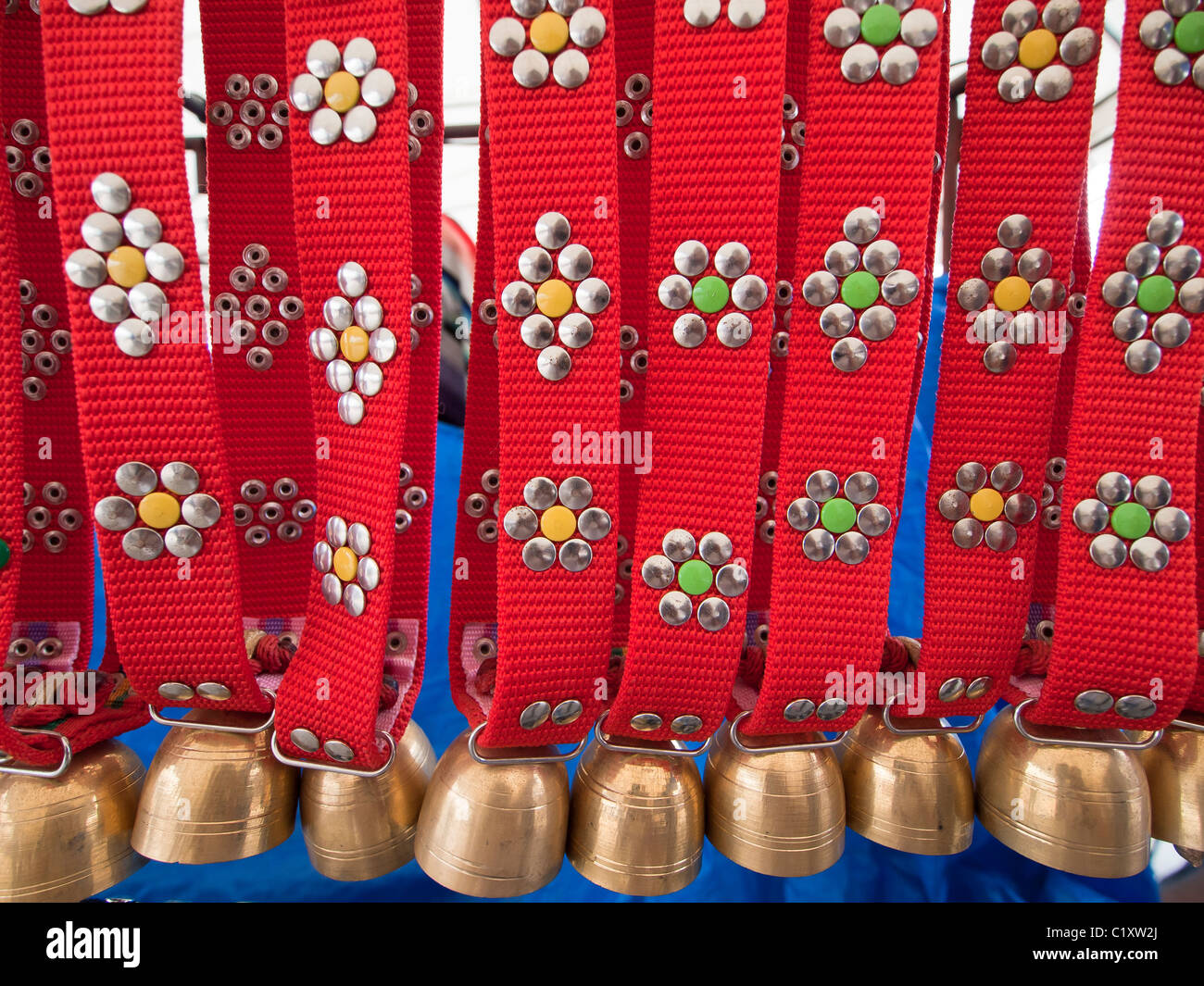 A row of brass cow bells for sale Stock Photo