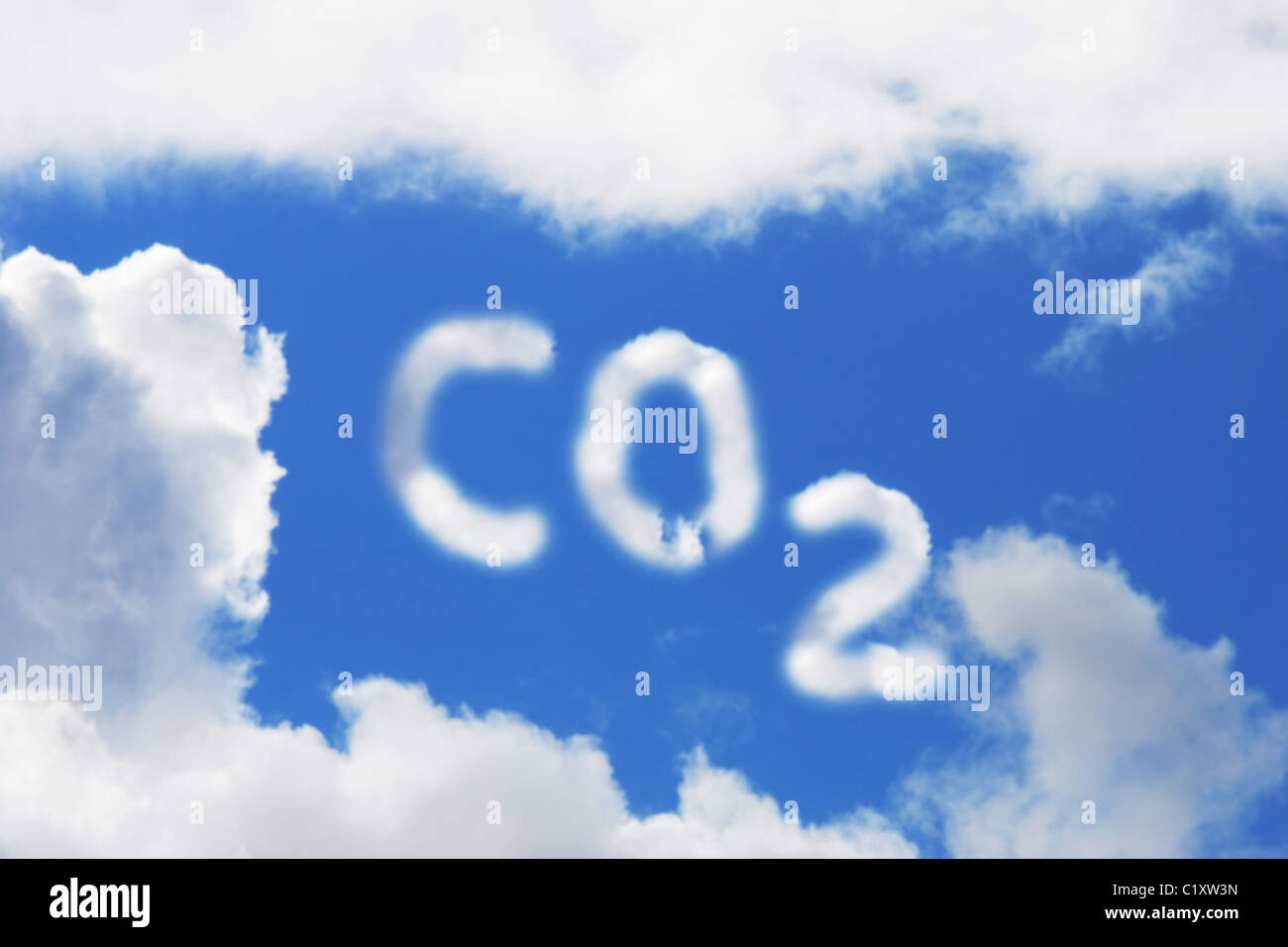 Carbon Dioxide symbol in blue sky and cloud Stock Photo