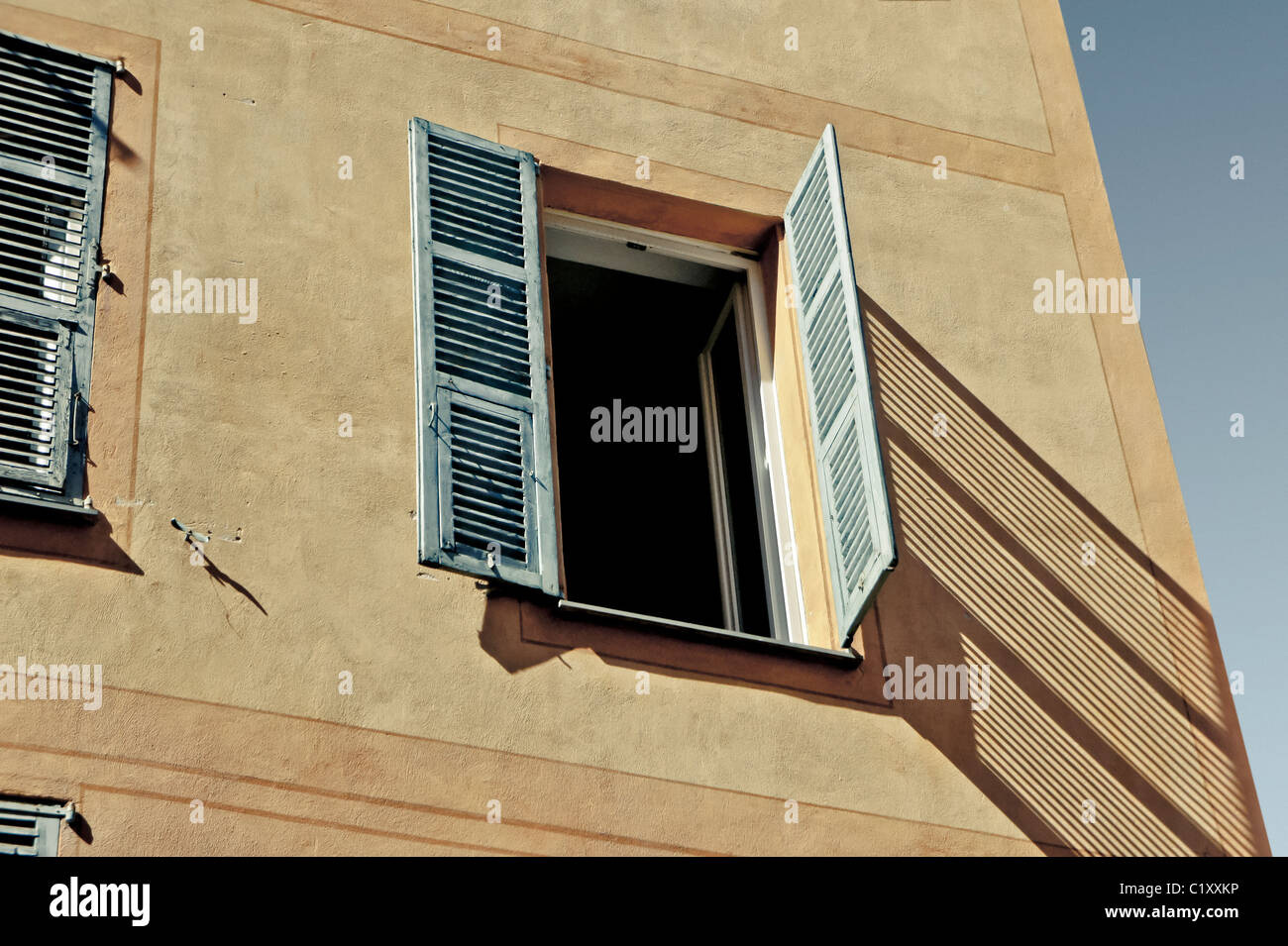 Old wooden shuttered window in the South of France Stock Photo